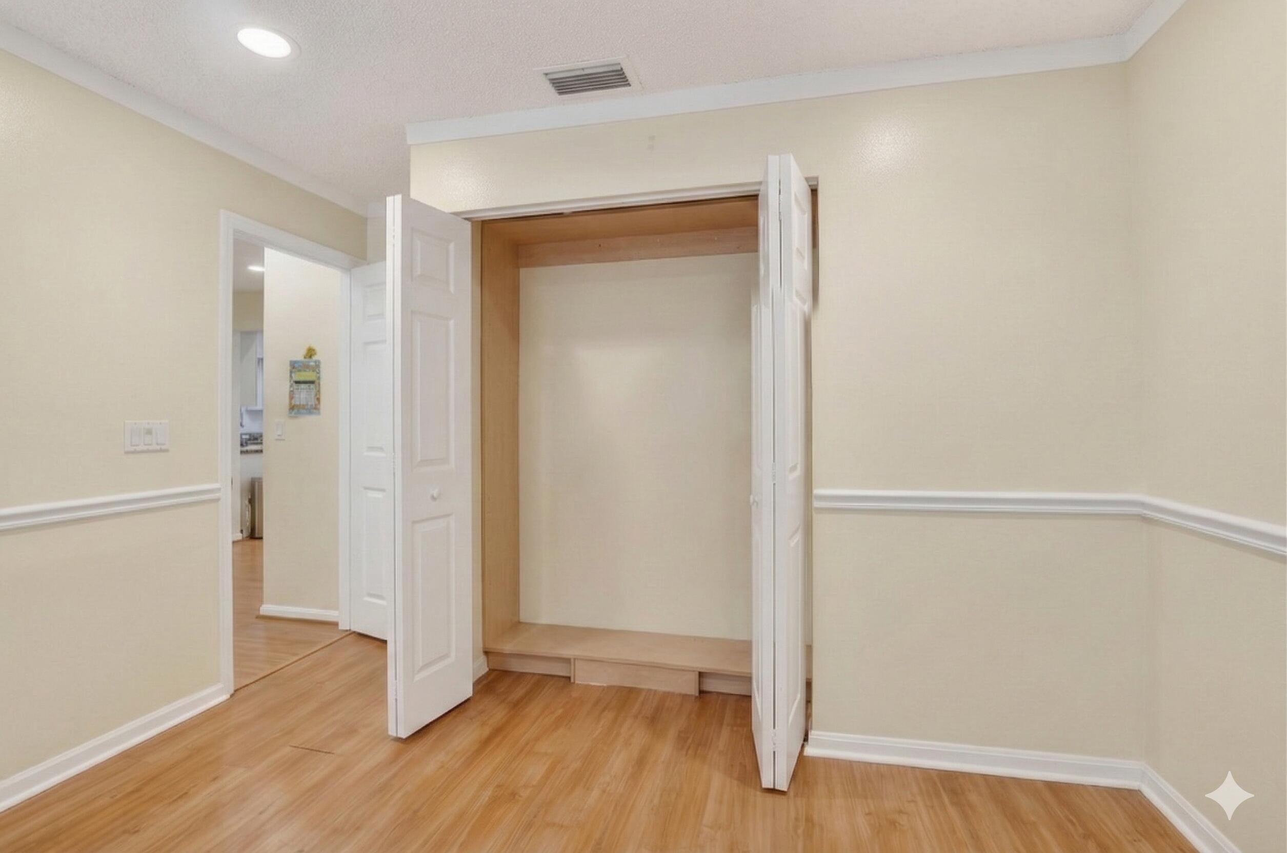 22220 Morning Glory Terrace Boca Raton, FL 33433 - Photo 26 of 69 a view of an empty room with wooden floor