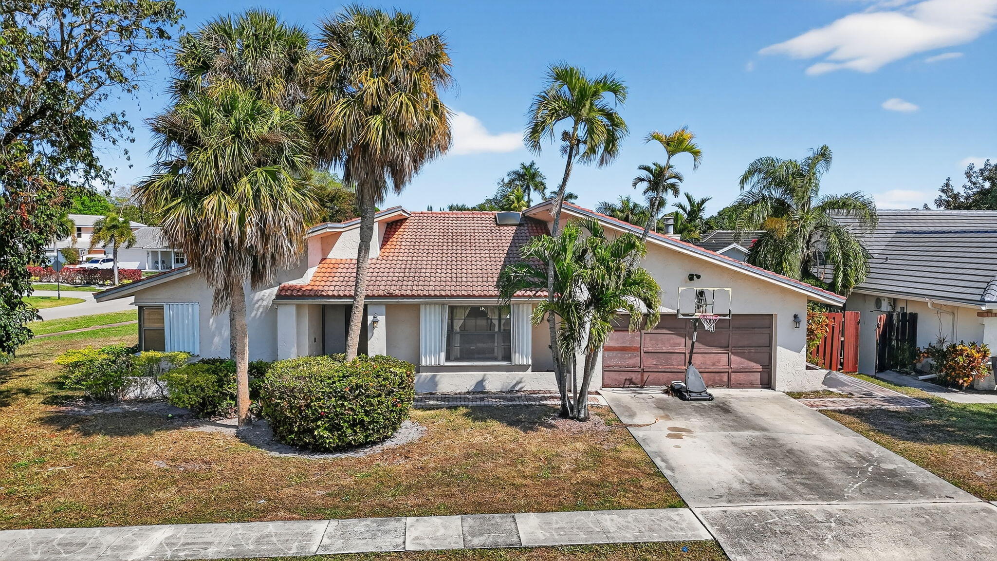 22220 Morning Glory Terrace Boca Raton, FL 33433 - Photo 33 of 69 front view of a house with a yard