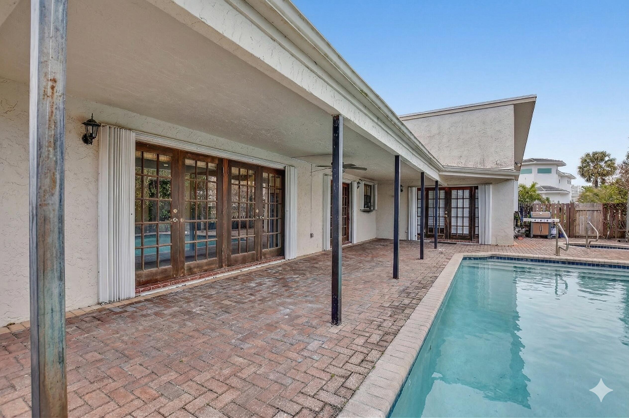 22220 Morning Glory Terrace Boca Raton, FL 33433 - Photo 34 of 69 a view of a patio with swimming pool table and chairs