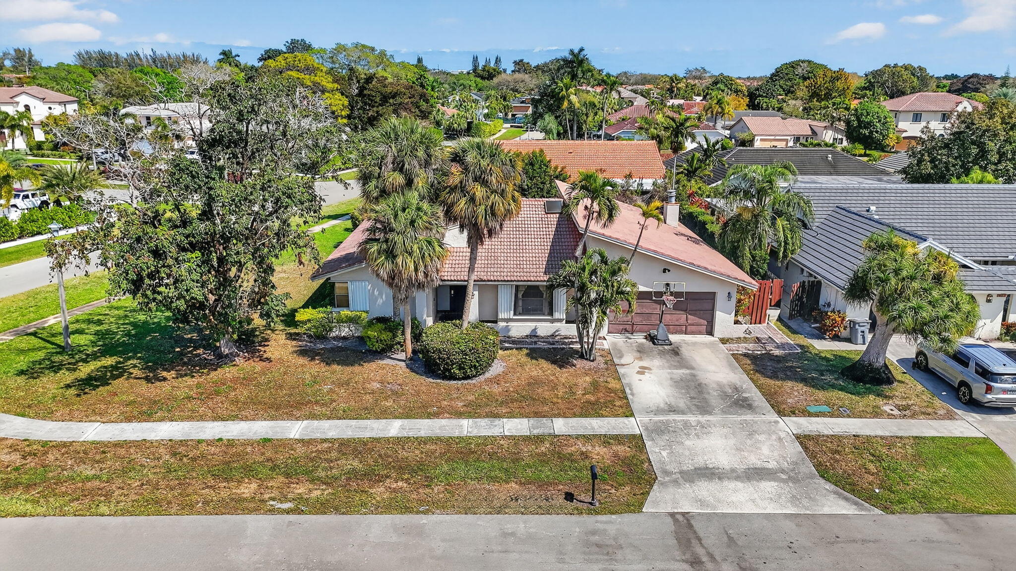 22220 Morning Glory Terrace Boca Raton, FL 33433 - Photo 35 of 69 front view of a house with a yard