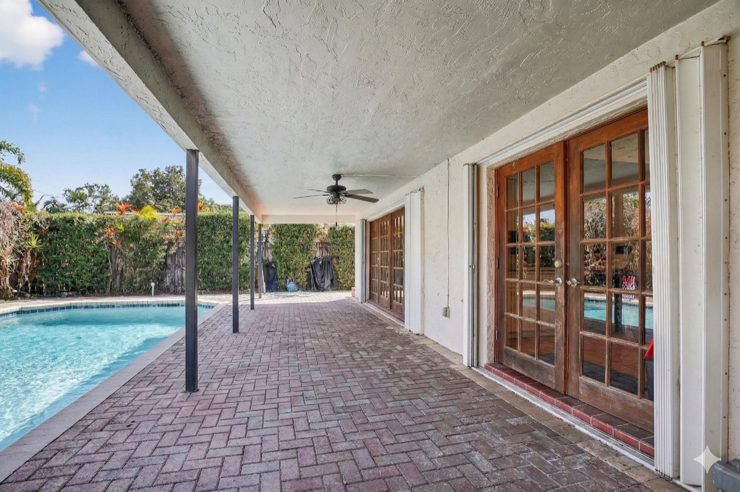 22220 Morning Glory Terrace Boca Raton, FL 33433 - Photo 36 of 69 a view of a porch with a backyard
