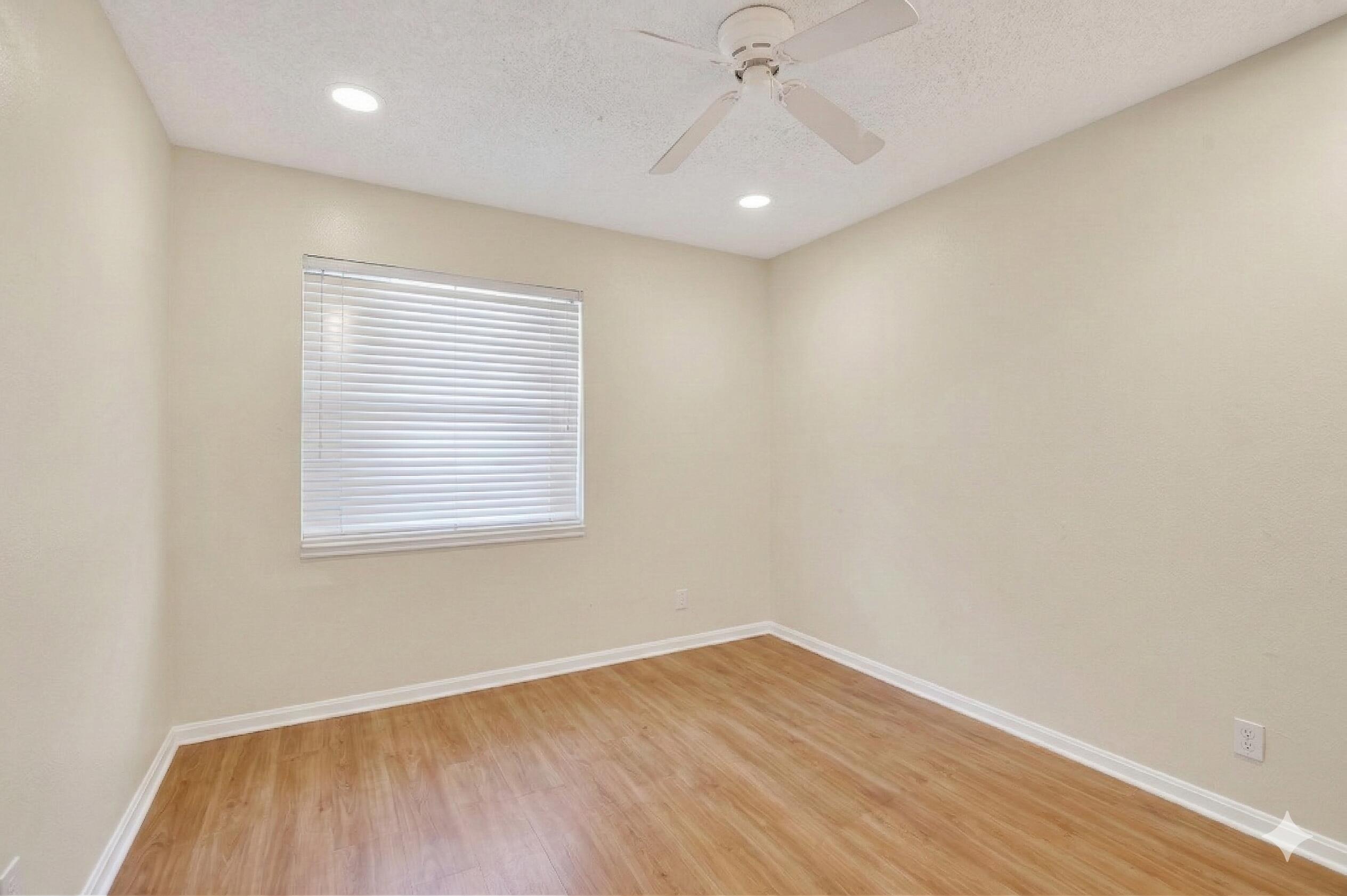 22220 Morning Glory Terrace Boca Raton, FL 33433 - Photo 57 of 69 wooden floor in an empty room with a window