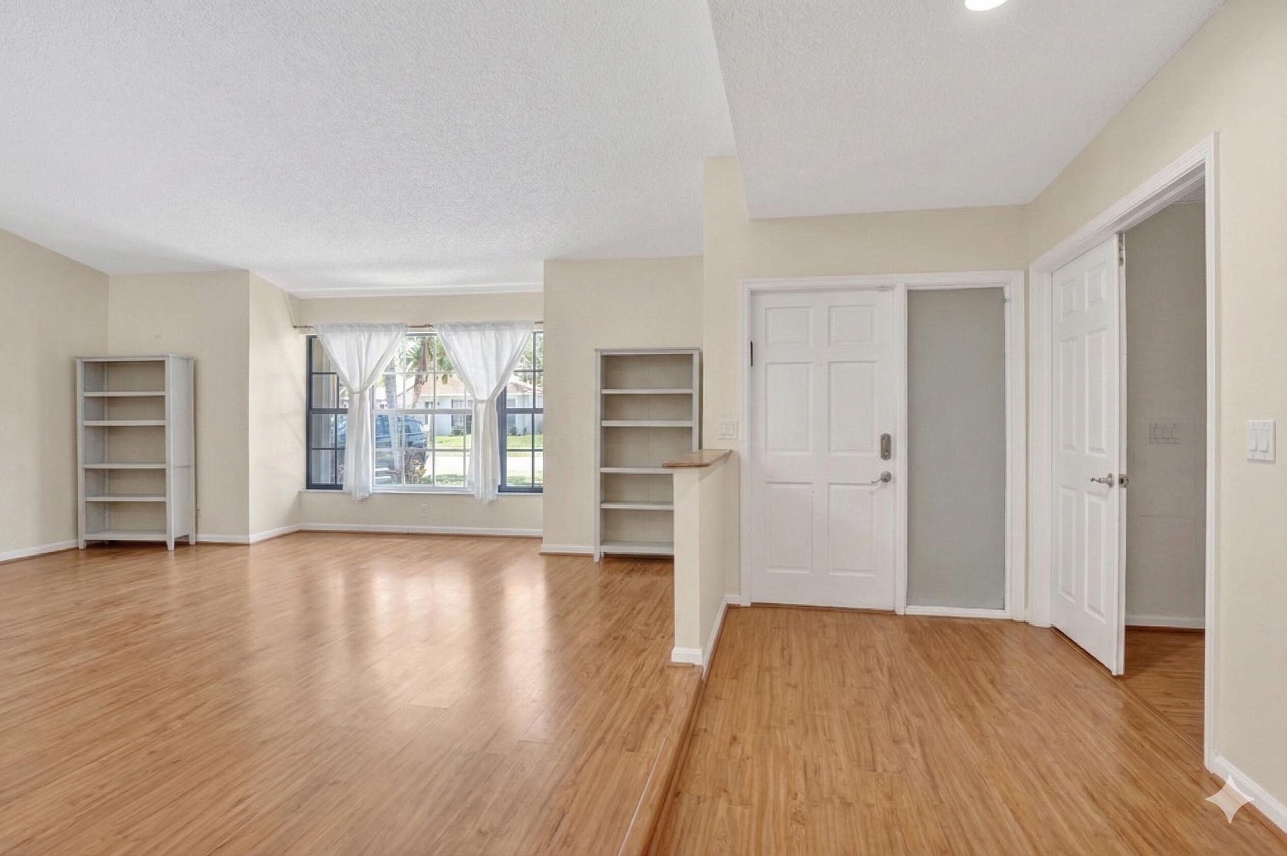 22220 Morning Glory Terrace Boca Raton, FL 33433 - Photo 60 of 69 wooden floor in an empty room with a window