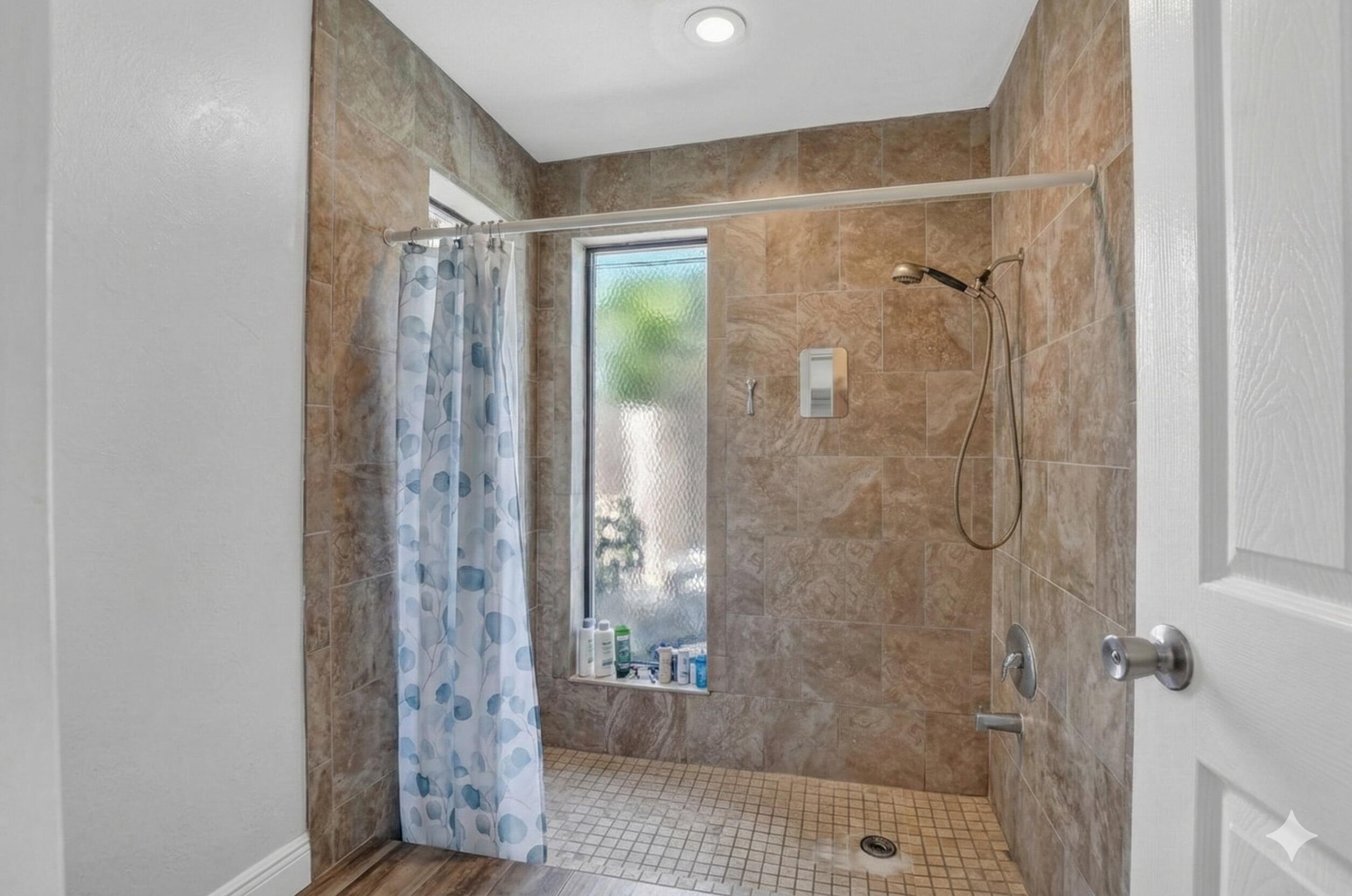 22220 Morning Glory Terrace Boca Raton, FL 33433 - Photo 65 of 69 a bathroom with a glass shower door