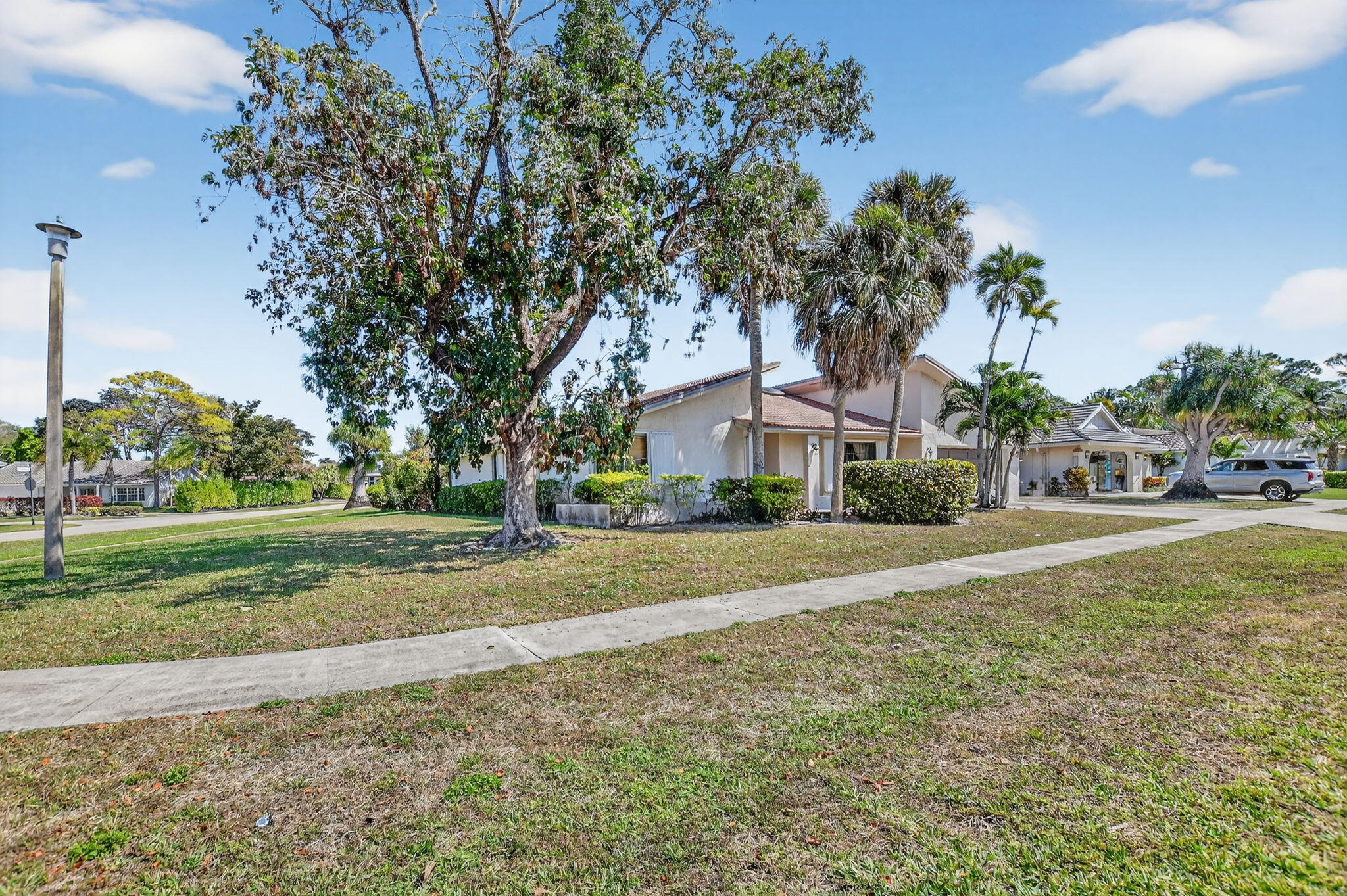 22220 Morning Glory Terrace Boca Raton, FL 33433 - Photo 7 of 69 a front view of house with yard and green space