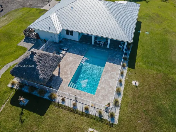 an aerial view of a house having patio