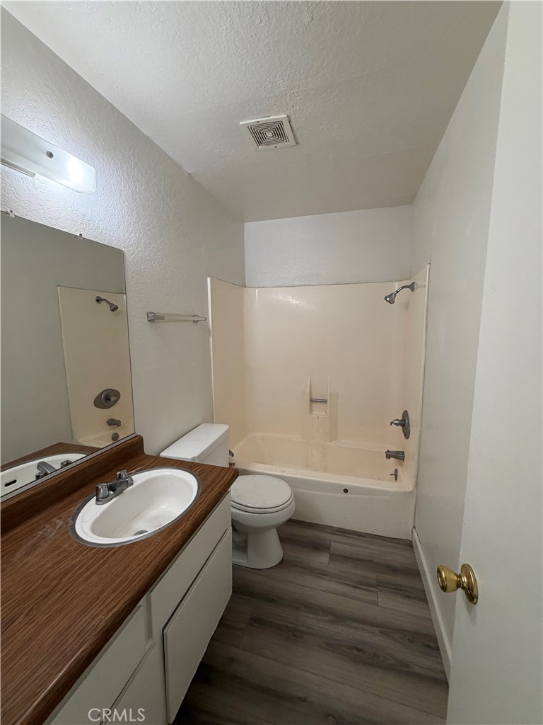 7405 Napa Court Rancho Cucamonga, CA 91730 - Photo 5 of 9 a bathroom with a sink and a mirror