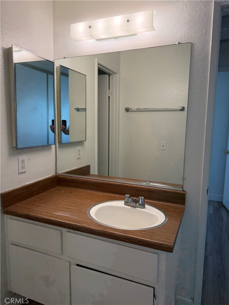 7405 Napa Court Rancho Cucamonga, CA 91730 - Photo 7 of 9 a bathroom with a sink and a mirror