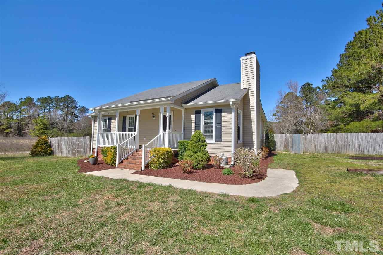 2937 Old Crews Road Raleigh, NC 27616 - Photo 1 of 19 a view of a house with backyard porch and sitting area