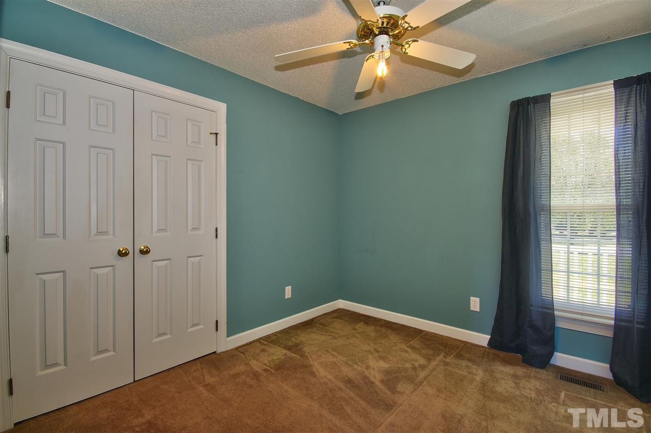 2937 Old Crews Road Raleigh, NC 27616 - Photo 13 of 19 a view of an empty room and window with a chandelier fan