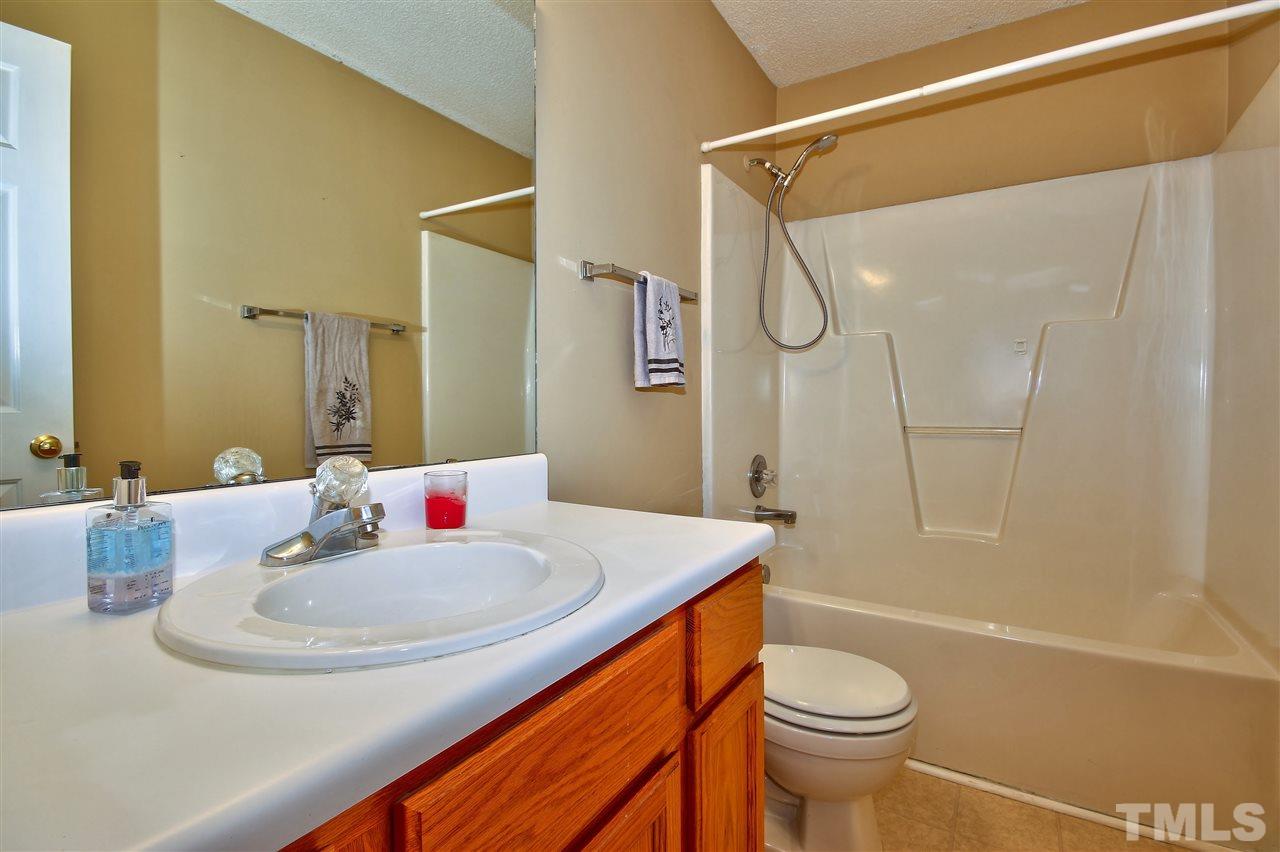 2937 Old Crews Road Raleigh, NC 27616 - Photo 14 of 19 a bathroom with a sink a toilet and shower