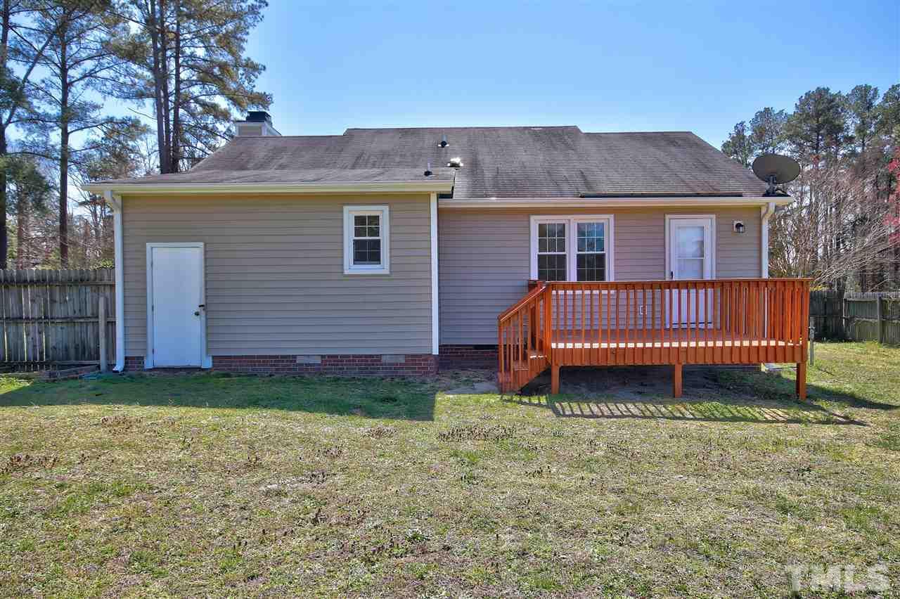 2937 Old Crews Road Raleigh, NC 27616 - Photo 15 of 19 a view of a house with a yard and deck