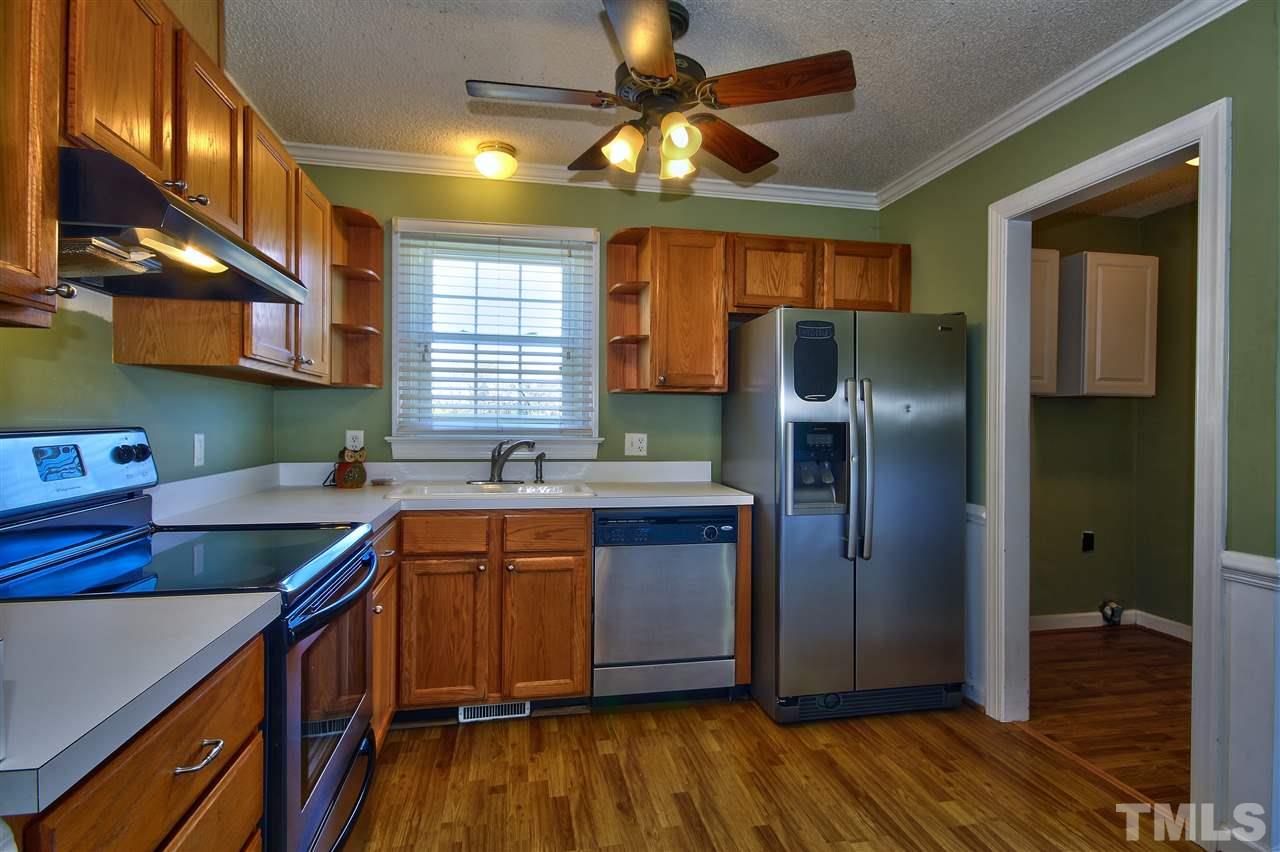 2937 Old Crews Road Raleigh, NC 27616 - Photo 10 of 19 a kitchen with stainless steel appliances granite countertop a refrigerator a sink and dishwasher