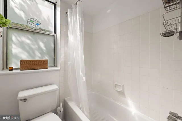 a bathroom with a sink vanity and mirror
