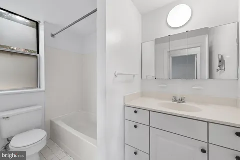 a bathroom with a bathtub and a toilet