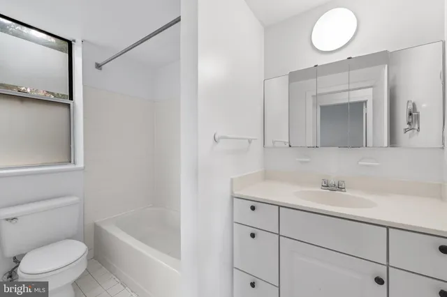 a bathroom with a bathtub and a toilet