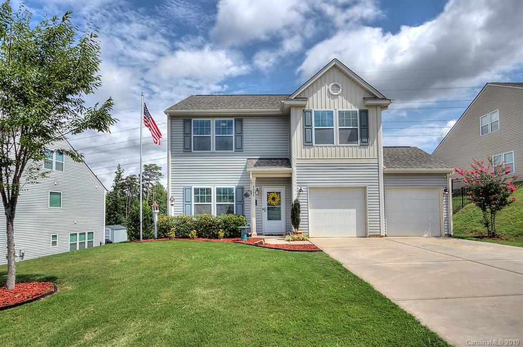 8008 Bryson Road Indian Land, SC 29707 - Photo 1 of 22 a front view of a house with a yard and garage