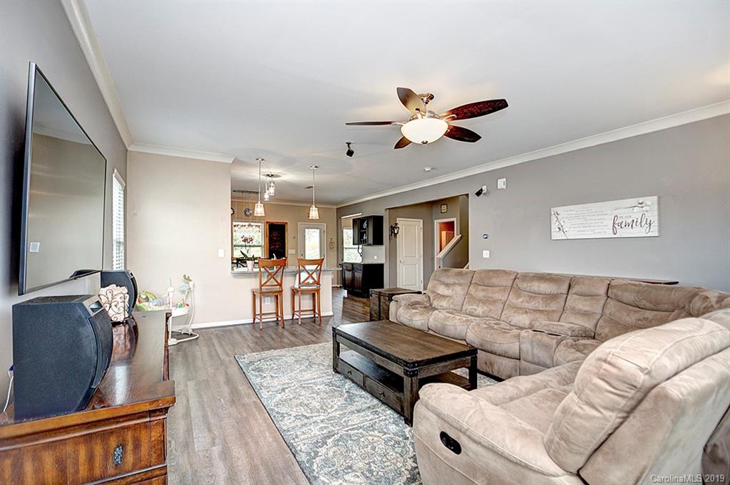 8008 Bryson Road Indian Land, SC 29707 - Photo 13 of 22 a living room with furniture and a flat screen tv