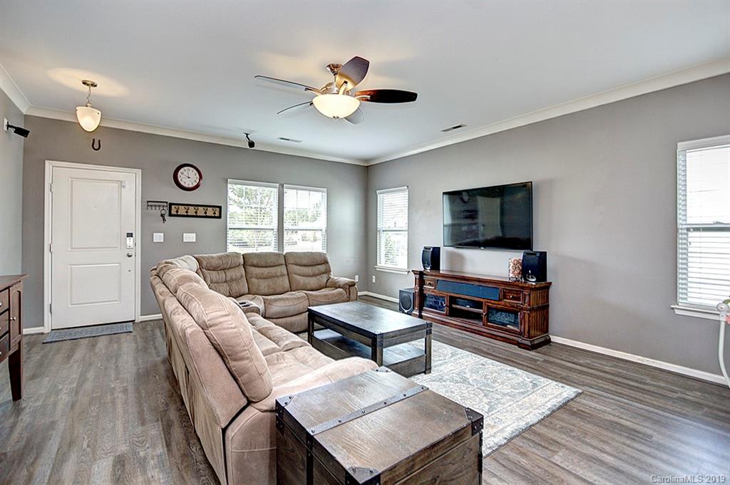 8008 Bryson Road Indian Land, SC 29707 - Photo 14 of 22 a living room with furniture a flat screen tv and a window