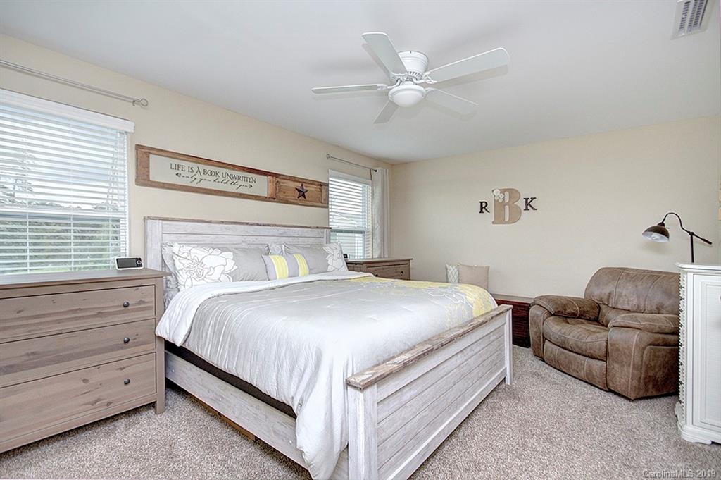 8008 Bryson Road Indian Land, SC 29707 - Photo 15 of 22 a bedroom with a bed and a couch