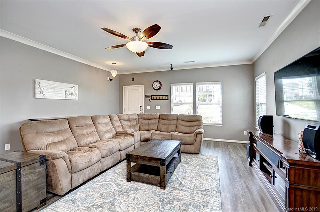 8008 Bryson Road Indian Land, SC 29707 - Photo 16 of 22 a living room with furniture flat screen tv and a window