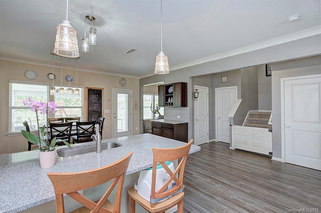8008 Bryson Road Indian Land, SC 29707 - Photo 17 of 22 a dining room with furniture a livingroom view and wooden floor