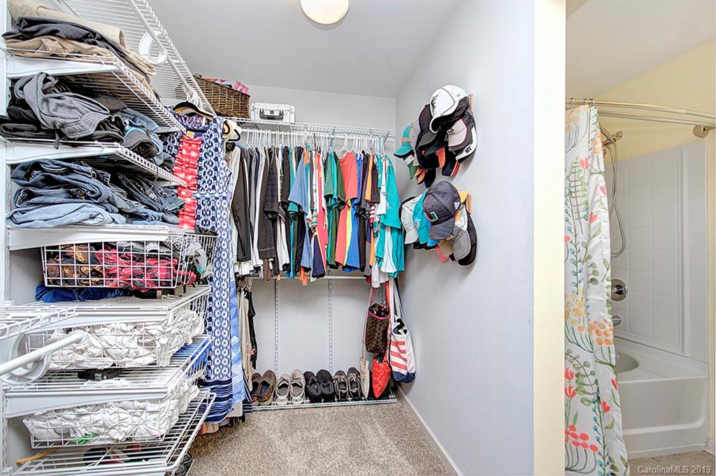 8008 Bryson Road Indian Land, SC 29707 - Photo 20 of 22 a view of walk in closet with clothes and shoes