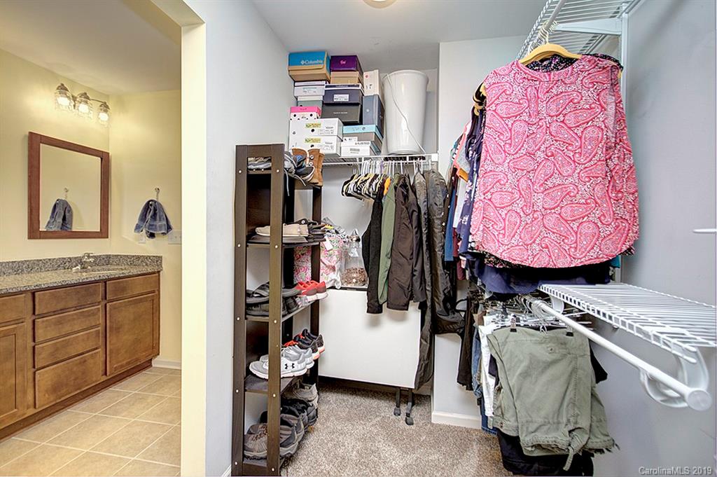 8008 Bryson Road Indian Land, SC 29707 - Photo 22 of 22 a view of walk in closet with clothes and shoes