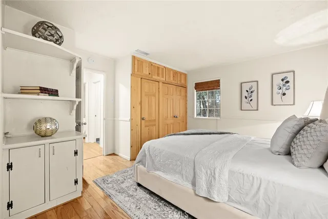 a bedroom with a bed and dresser