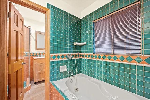 a bathroom with a bathtub and shower