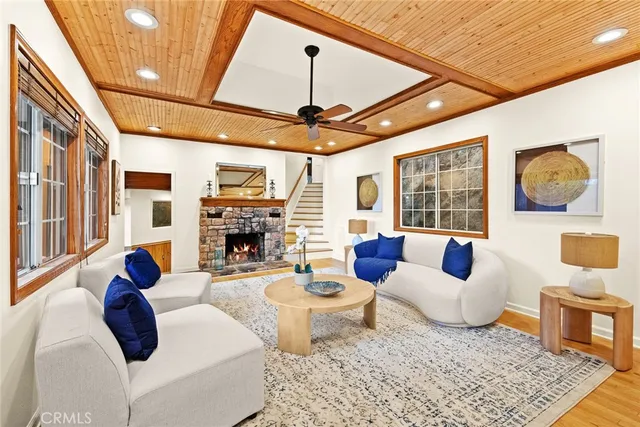 a living room with fireplace furniture and a fireplace