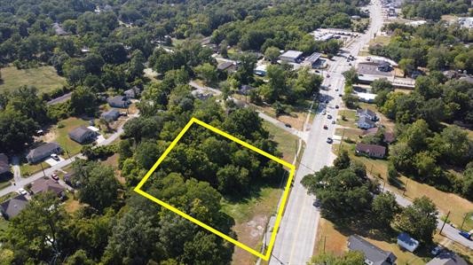 an aerial view of residential house with outdoor space and street view