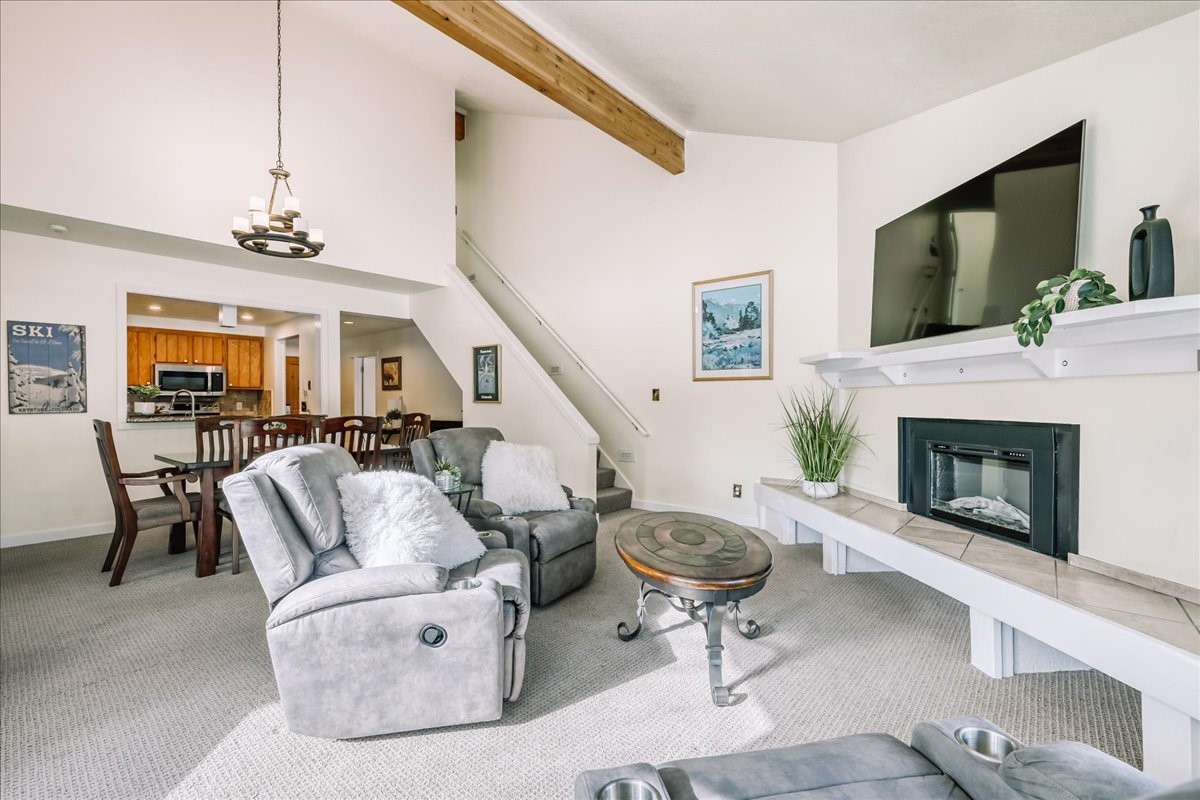 22280 Highway 6, Unit 1716 Keystone, CO 80435 - Photo 2 of 27 a living room with furniture and a fireplace