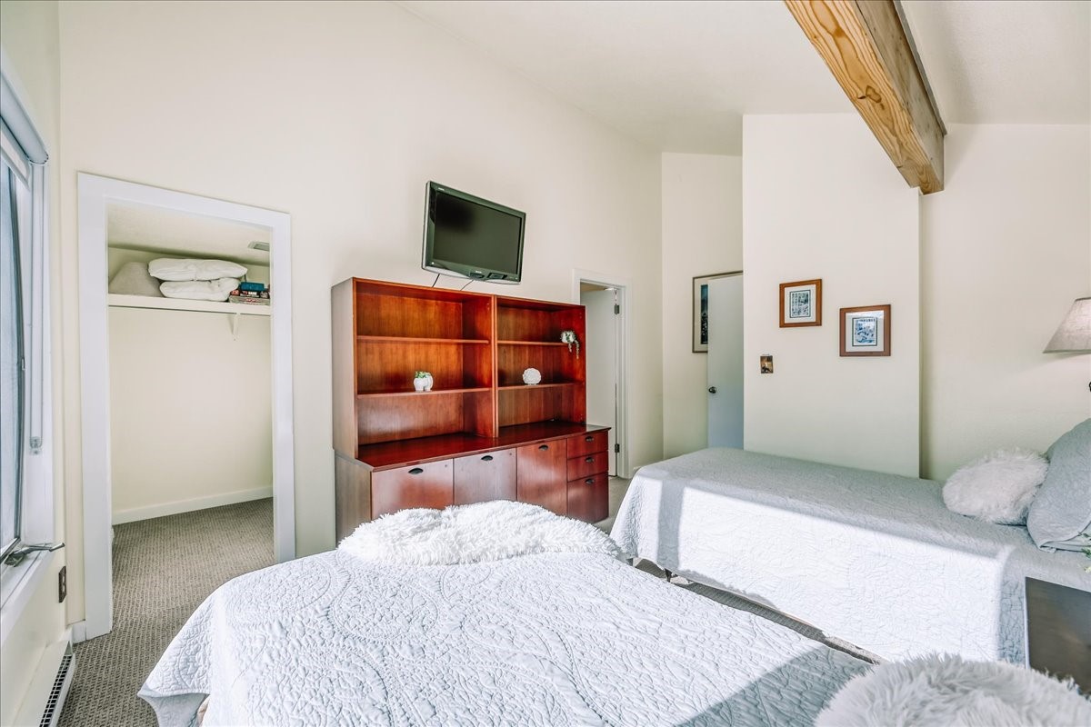 22280 Highway 6, Unit 1716 Keystone, CO 80435 - Photo 21 of 27 a bedroom with a bed and a television