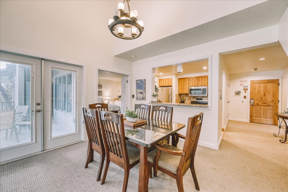 22280 Highway 6, Unit 1716 Keystone, CO 80435 - Photo 4 of 27 a view of a dining room with furniture window and wooden floor