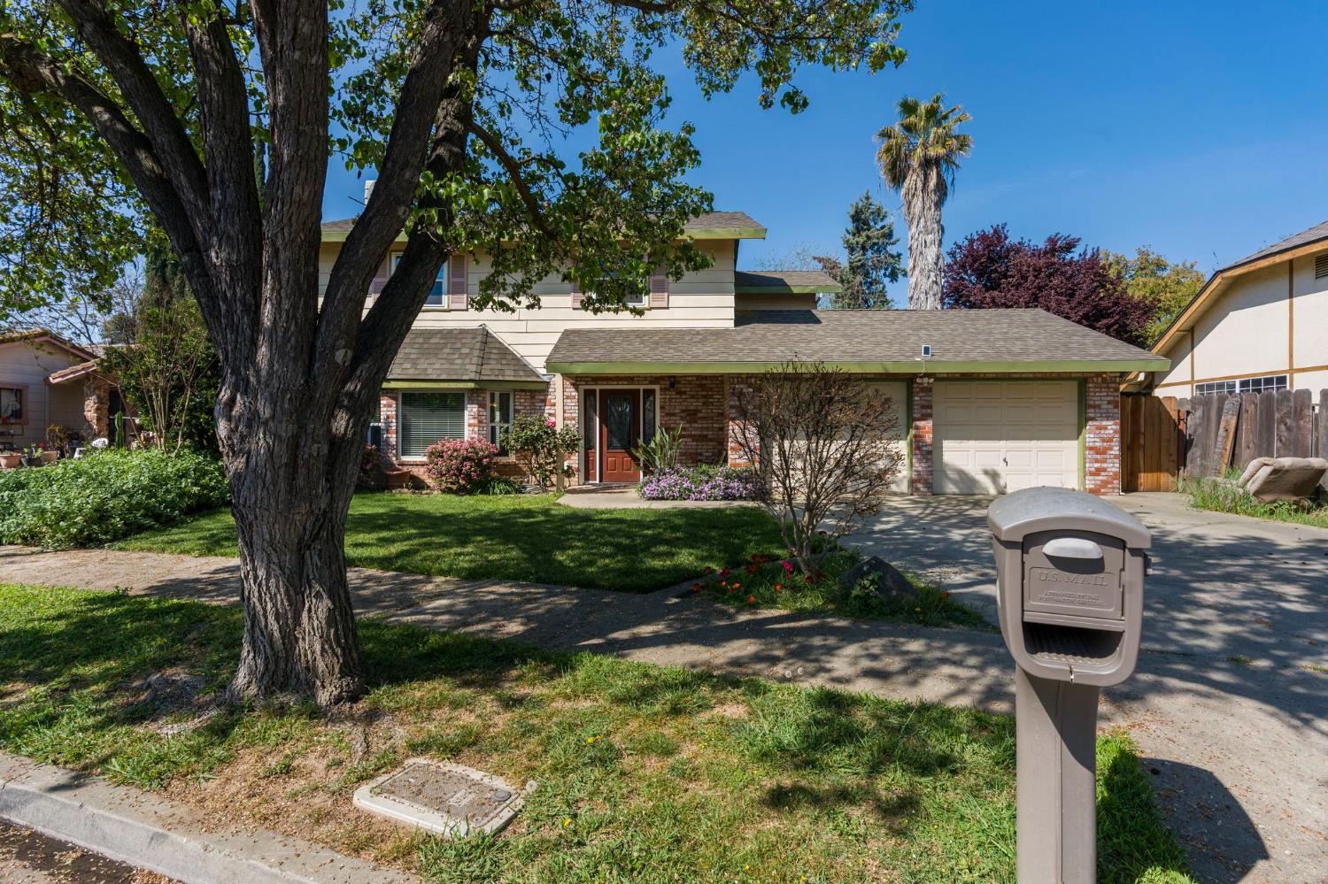 2779 Story Avenue Merced, CA 95340 - Photo 3 of 27 a front view of a house with garden