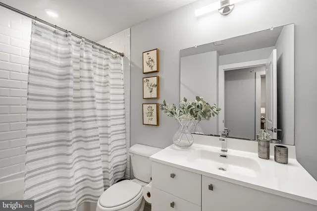 a bathroom with a shower and a toilet