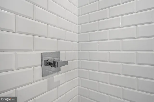 a view of a chair and tables in the backyard of the house