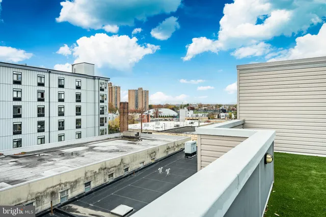 a view of a patio with table and chairs and potted plants