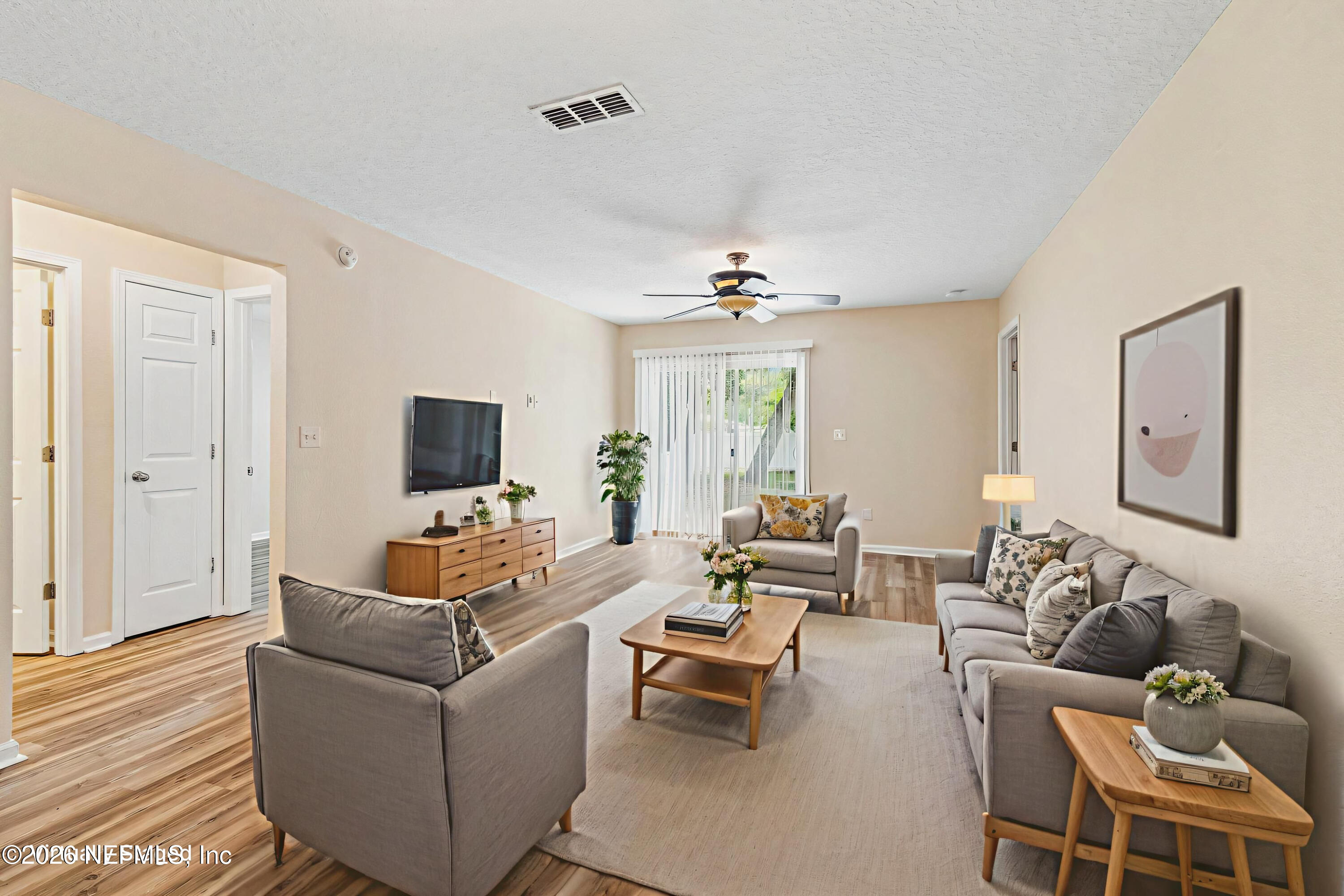 73 South Twin Maple Road St. Augustine, FL 32084 - Photo 16 of 59 a living room with furniture and a flat screen tv
