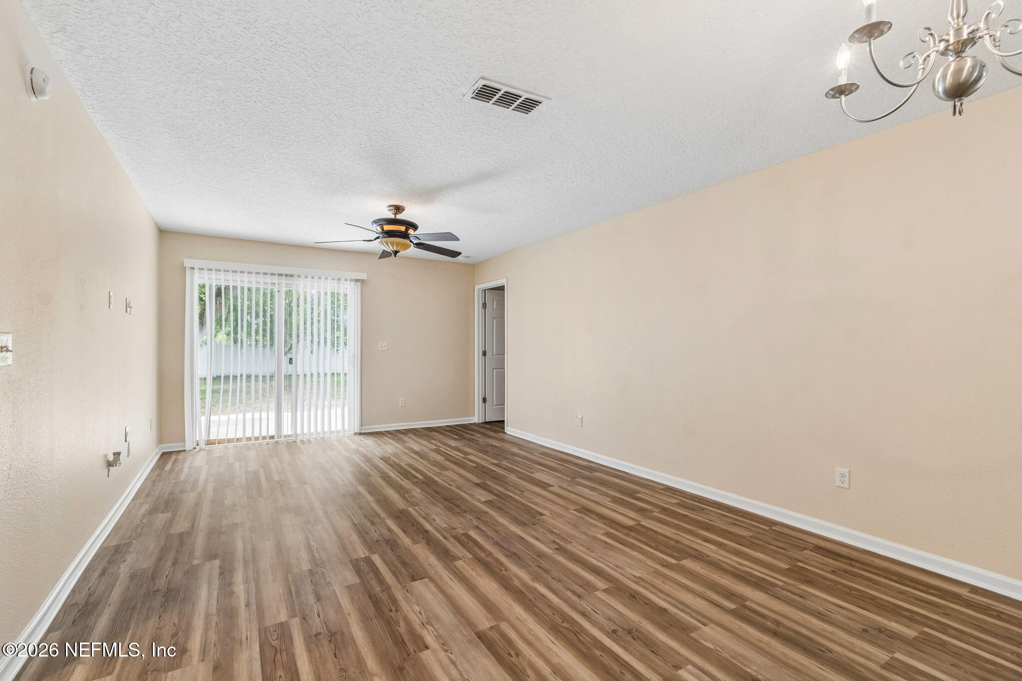 73 South Twin Maple Road St. Augustine, FL 32084 - Photo 17 of 59 wooden floor in an empty room with a window