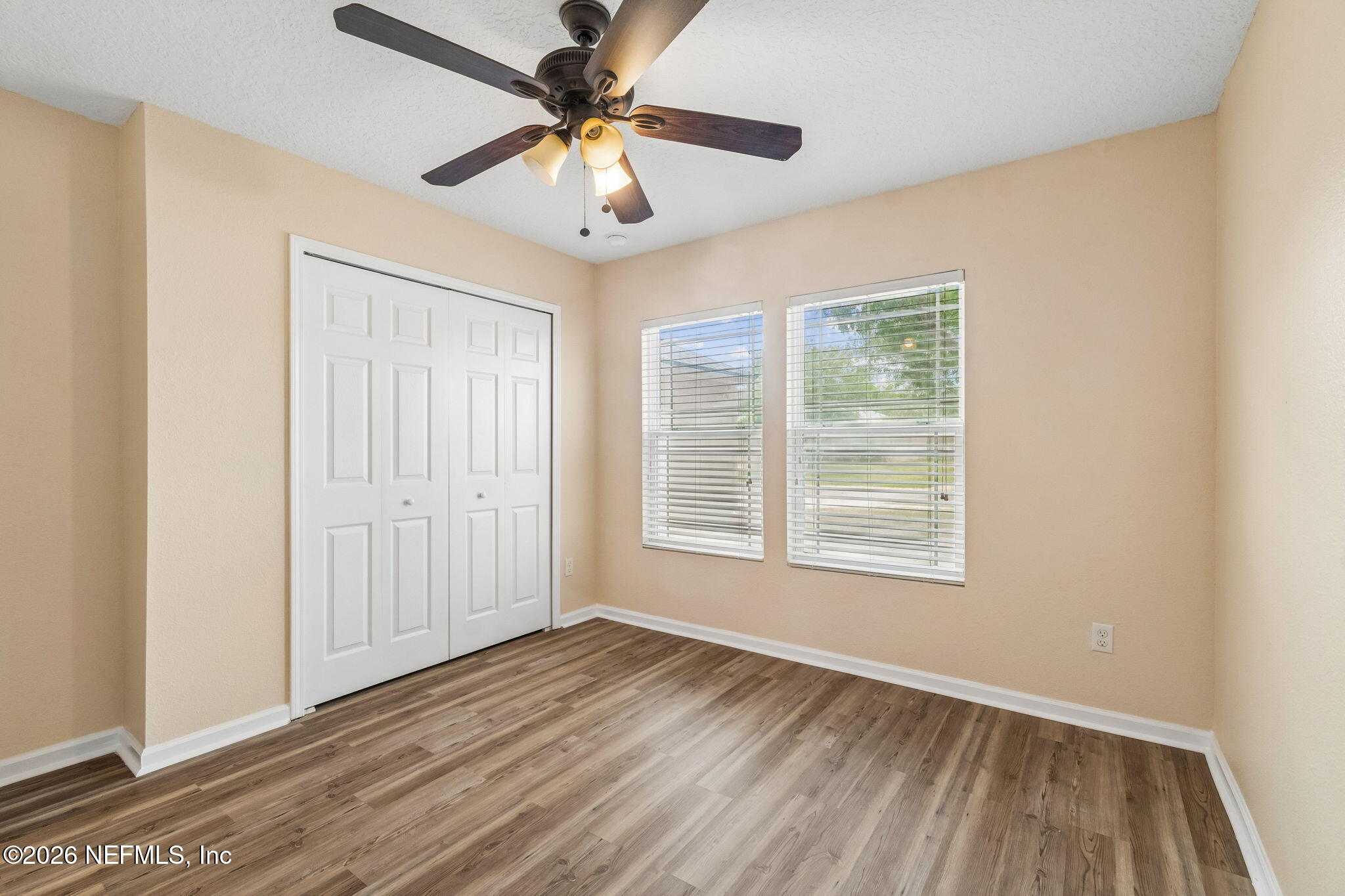 73 South Twin Maple Road St. Augustine, FL 32084 - Photo 32 of 59 wooden floor in an empty room with a window
