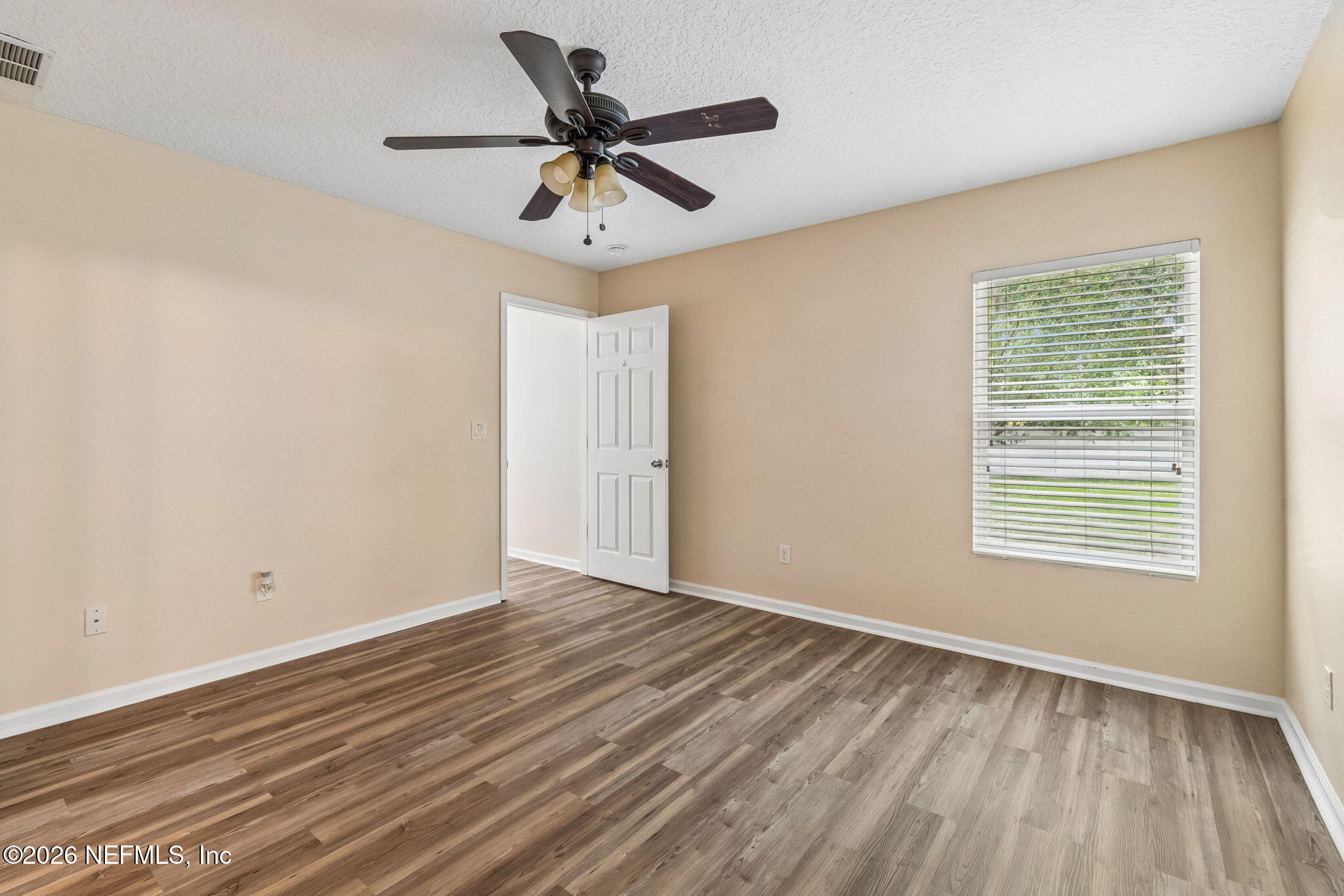 73 South Twin Maple Road St. Augustine, FL 32084 - Photo 36 of 59 a view of a big room with wooden floor and windows