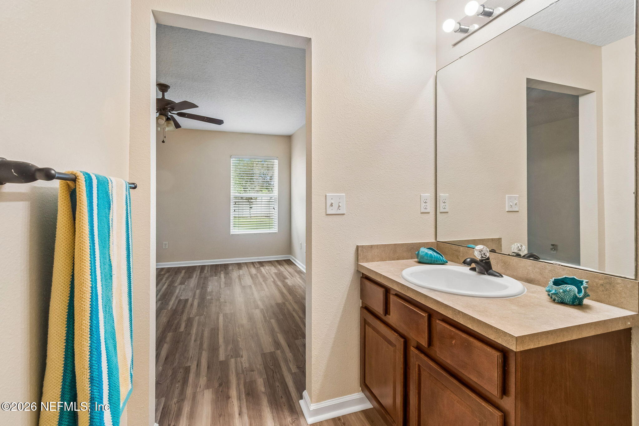 73 South Twin Maple Road St. Augustine, FL 32084 - Photo 41 of 59 a bathroom with a sink and a mirror
