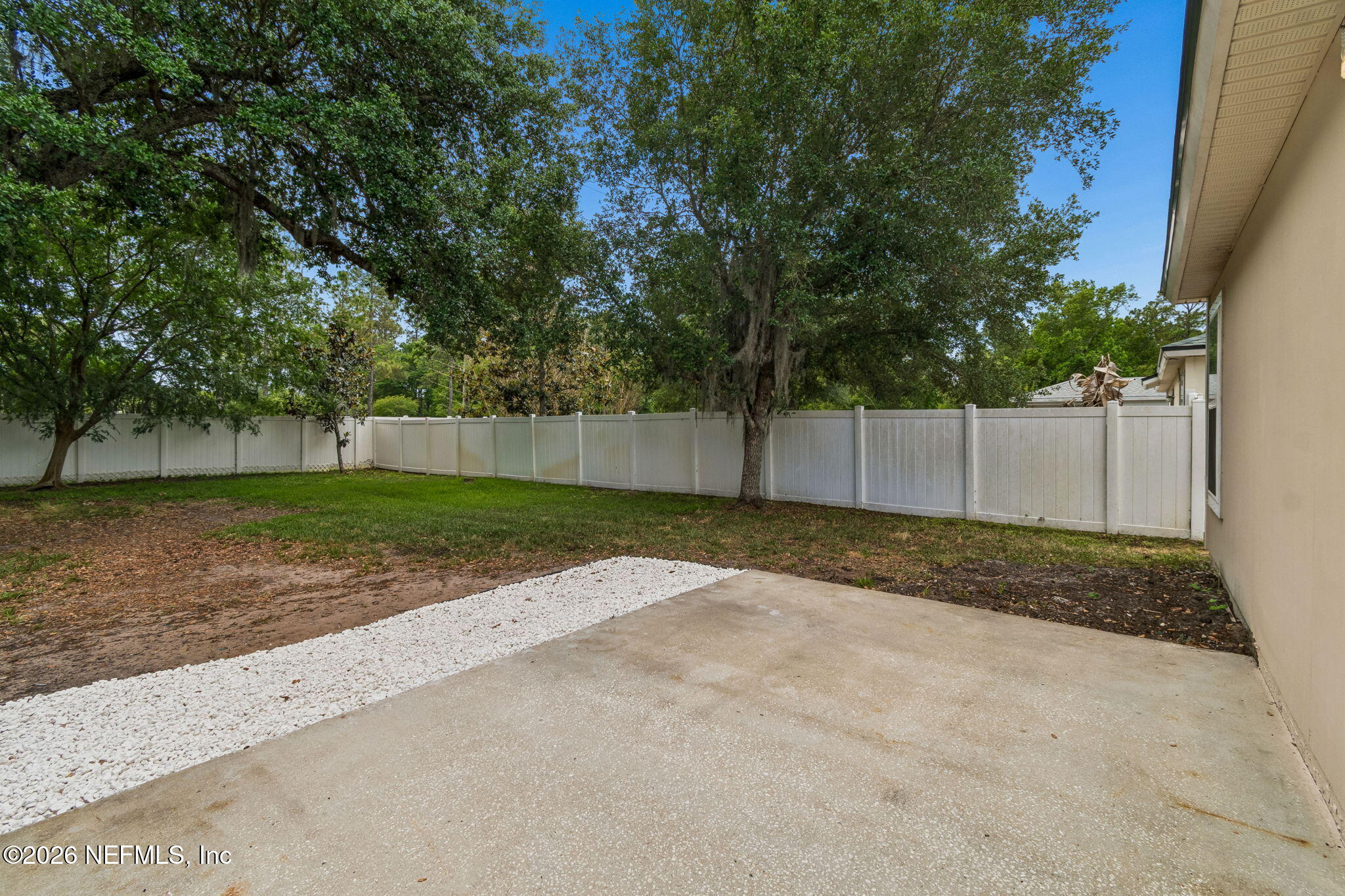 73 South Twin Maple Road St. Augustine, FL 32084 - Photo 46 of 59 a view of a yard with wooden fence