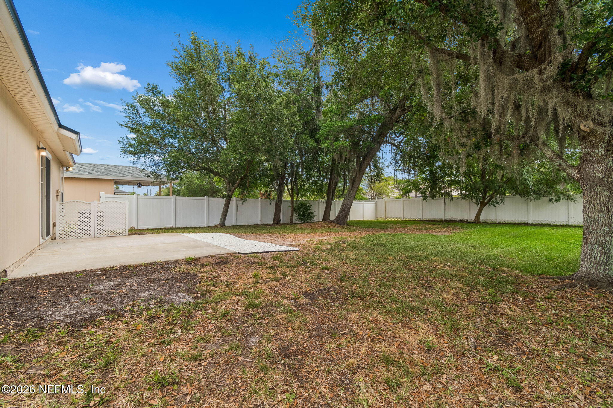73 South Twin Maple Road St. Augustine, FL 32084 - Photo 48 of 59 a backyard of a house with lots of green space