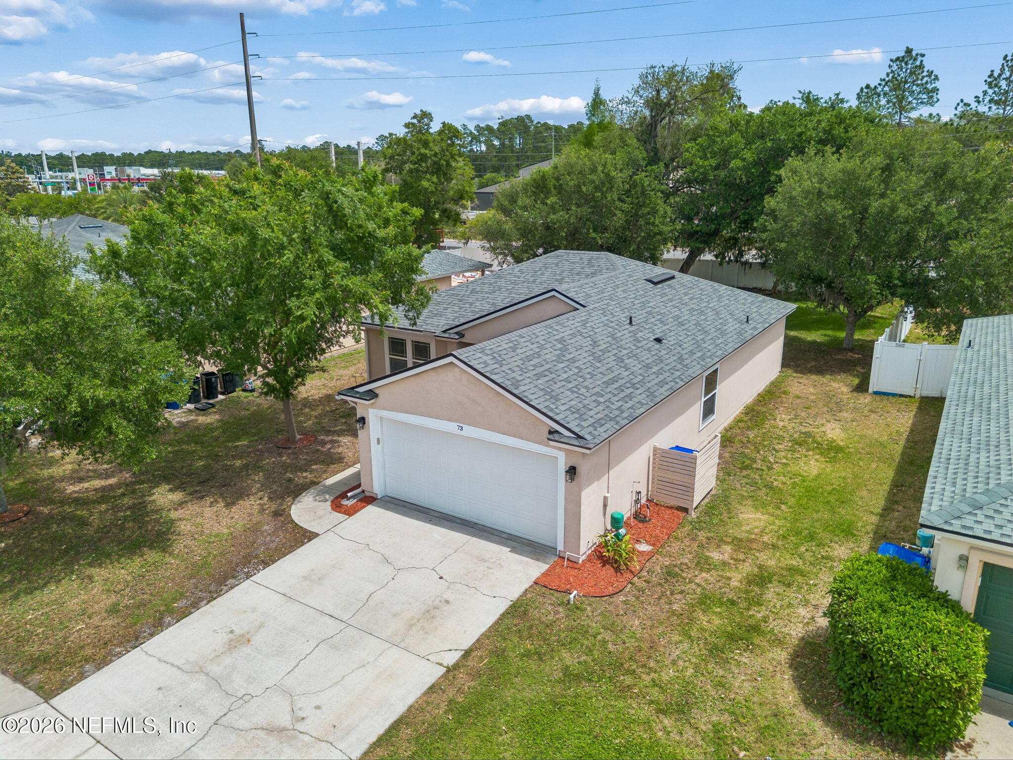 73 South Twin Maple Road St. Augustine, FL 32084 - Photo 51 of 59 a aerial view of a house with a yard