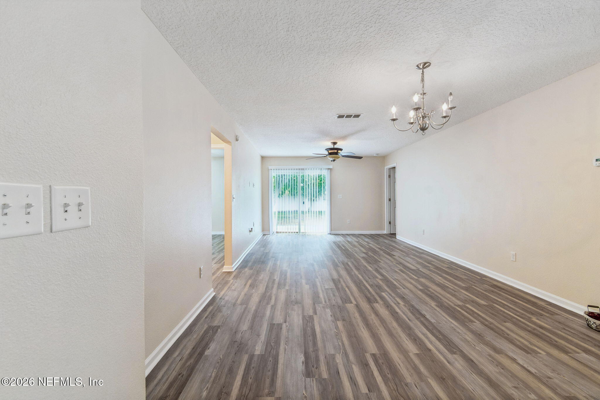 73 South Twin Maple Road St. Augustine, FL 32084 - Photo 8 of 59 a view of a room with wooden floor and window