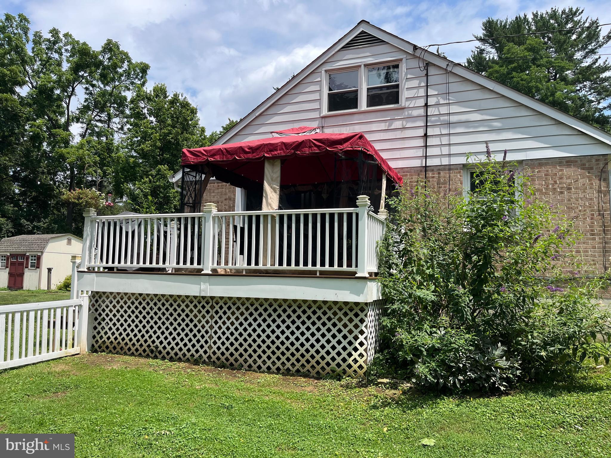 393 Mountain View Road Reading, PA 19607 - Photo 2 of 21 a front view of a house with a garden