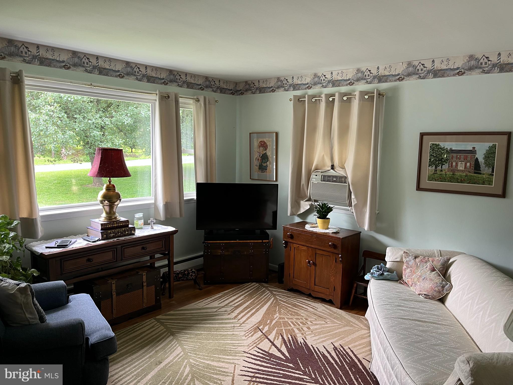 393 Mountain View Road Reading, PA 19607 - Photo 9 of 21 a living room with furniture and a flat screen tv
